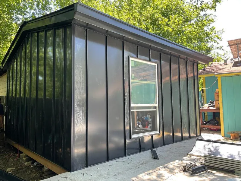 Black standing seam metal wall panels for Roof Inspection in Dallas