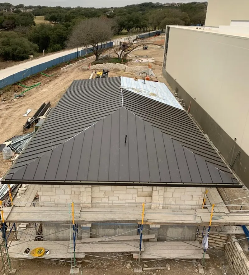 Metal roof new construction with scaffolding in Dallas